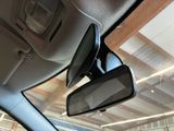 a rear view mirror of a car in a car showroom