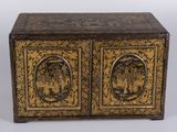 an old wooden chest with two doors and two pictures on the front