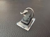 a cell phone that is sitting on a stand on a table