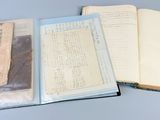 several old papers are sitting on top of a blue table