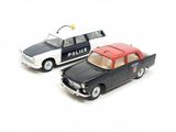 two toy cars sitting next to each other on a white surface