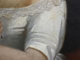 a painting of a woman in a white dress holding a pink rose