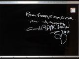 a blackboard with writing on it in a room