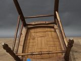 an old wooden chair sitting on top of a wooden floor
