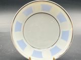 an image of a blue and white plate sitting on top of a table