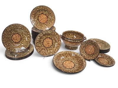 a group of brown and black plates and bowls