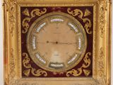 a clock that is hanging on the wall in the room