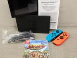 Console de jeux Nintendo Wii avec deux manettes et un coffret de jeux