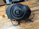a black fan sitting on a wooden table in a room