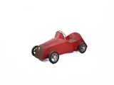 wooden toy of a red race car on a white background