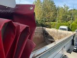 a truck that has a red cloth on the back of it