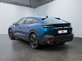 the rear of a blue 2021 toyota c - hr in a white room