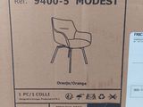 a cardboard box with a picture of a modern chair in it