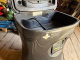 a cooler that is sitting on the floor in the room