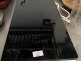 a laptop computer sitting on top of a counter