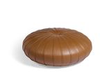 brown leather pouffe on white background with clipping for text