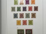 an image of a picture of a collection of stamps in a white frame