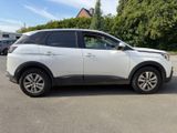 a picture of a white suv parked in a parking lot