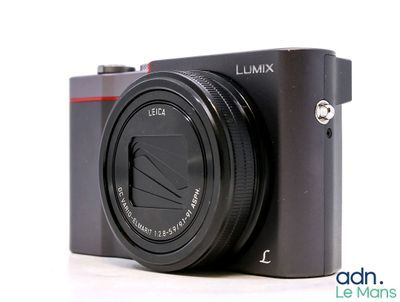 a camera that is sitting on a white surface