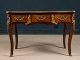 a small wooden table with two drawers on top of it