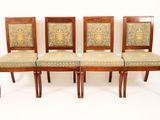 four chairs with upholstered back and upholstered seat covers