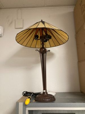 a lamp that is sitting on top of a microwave