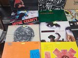 a lot of records on a table in a room