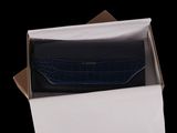 a box with a wallet inside of it on a black background