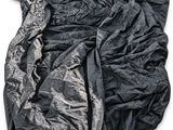 an image of a black jacket on a white background with a logo on it