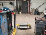 a picture of a fork lift truck in a garage