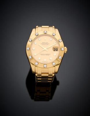 an 18k yellow gold and diamond set lady ' s wristwatch