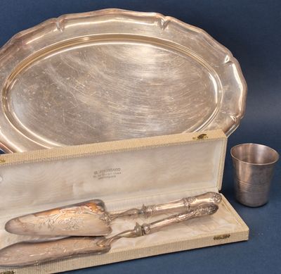 a silver tray with a knife, spoon and cup on it