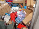 a pile of boxes and other items in a room