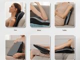 a picture of a woman sitting on a couch with her legs up