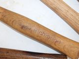 four different types of baseball bats on a table