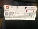 a close up of a car ' s engine label on the back of the vehicle