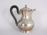a silver coffee pot with a black handle on a white background