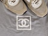 a picture of a pair of shoes that are on top of a blanket