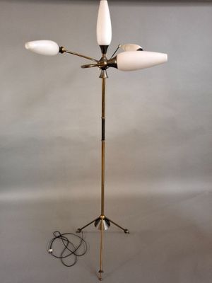 a close up of a lamp on a tripod stand with wires