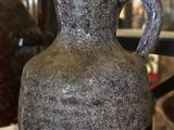 a vase that is sitting on a glass table
