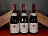 three bottles of wine sitting next to each other on a table