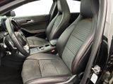 the interior of a car with black leather seats and red trims