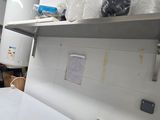 a kitchen with a sink and a stove in it