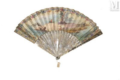 a fan with a painting on it hanging on a wall