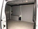a white van with the door open in a garage