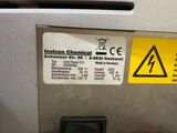 a close up of a machine with a warning sticker on it