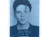 a black and white photo of a man in a mug shot