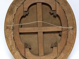 an image of a wooden circular object with a cross in the center