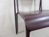 a chair that is sitting in front of a white wall