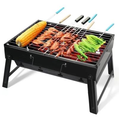 un barbecue sur lequel sont disposés différents types de légumes